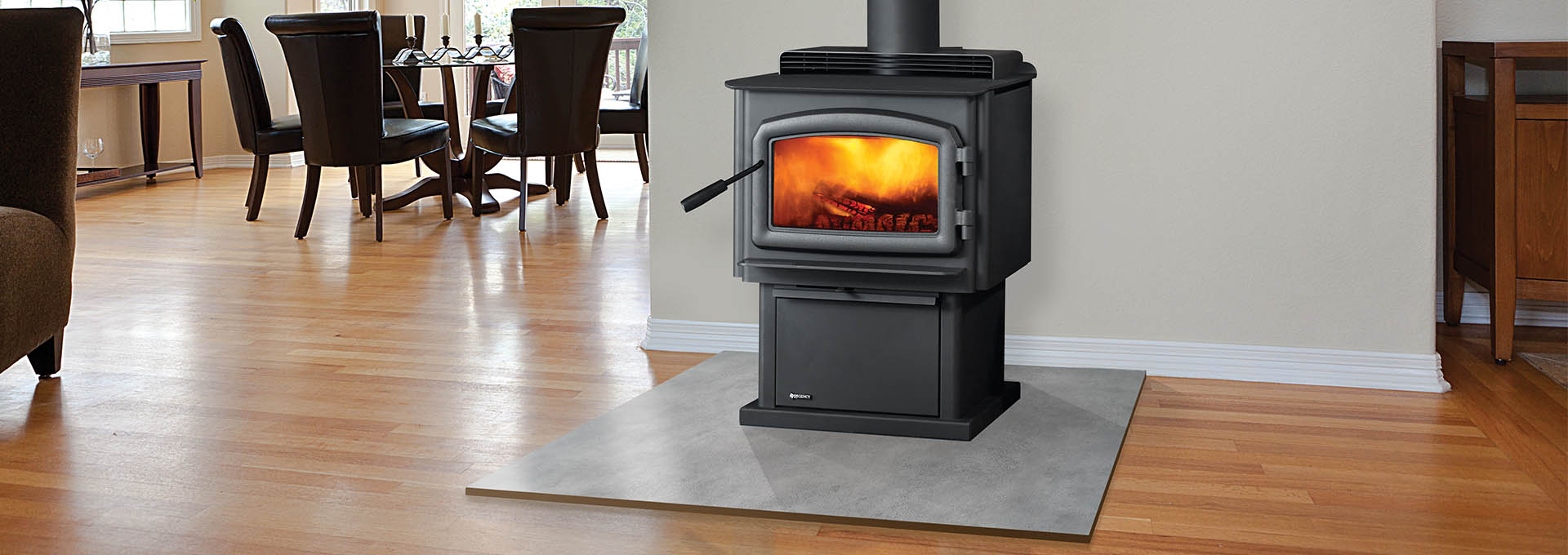 black, free-standing wood stove made by regency near kitchen